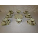 Palissy Art Deco style tea set, cream with black trim and abstract pattern in red yellow and