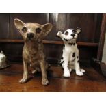 Two Winstanley dogs - a seated Dalmatian puppy with brown glass eyes, height 23cm, marked ENGLAND