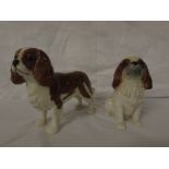 A Beswick model of a standing brown and white spaniel (height 13cm), and a Sylvac model of a