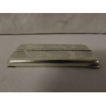 Edwardian silver stamp holder of oblong form with central sprung hinge and three compartments