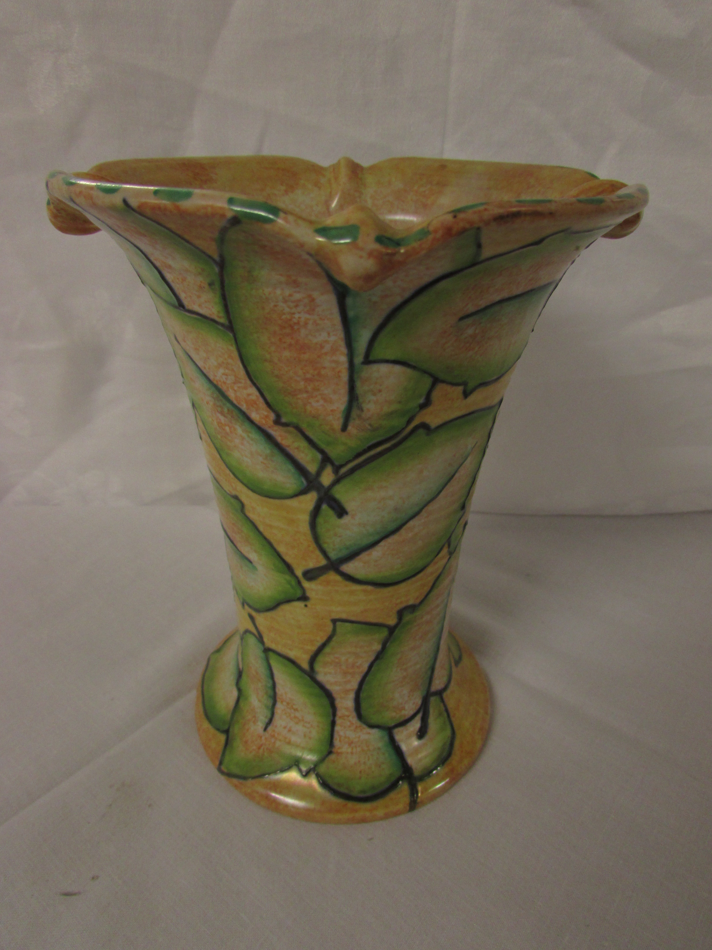 A Burleigh vase signed Bennett, yellow painted with green stylized leaves, of flared form with