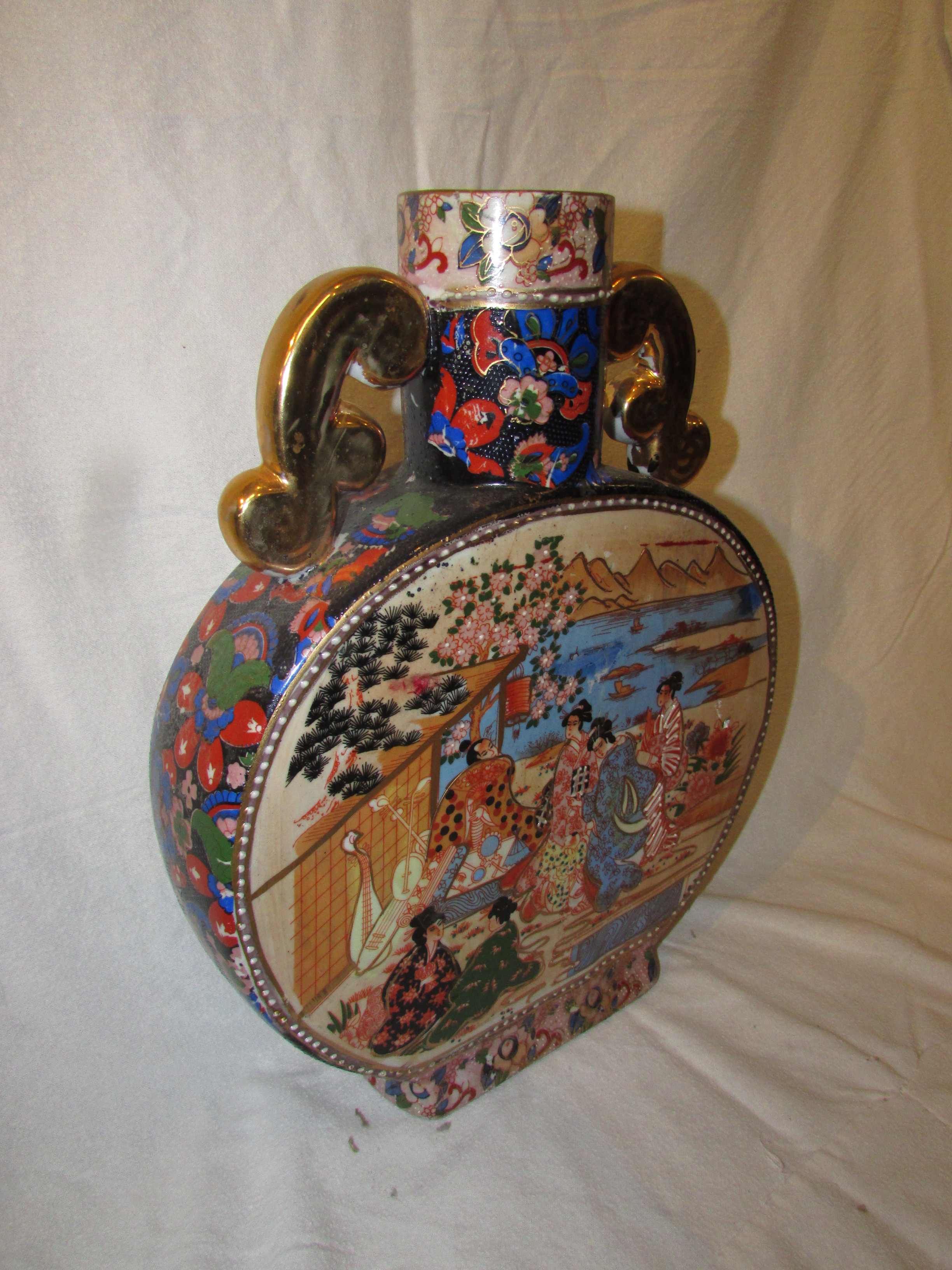 20th century Chinese porcelain moon flask, transfer decorated with figures in garden scenes,