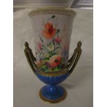 A French porcelain urn shaped vase hand-painted with flowers, blue foot and gilding, marked D T L