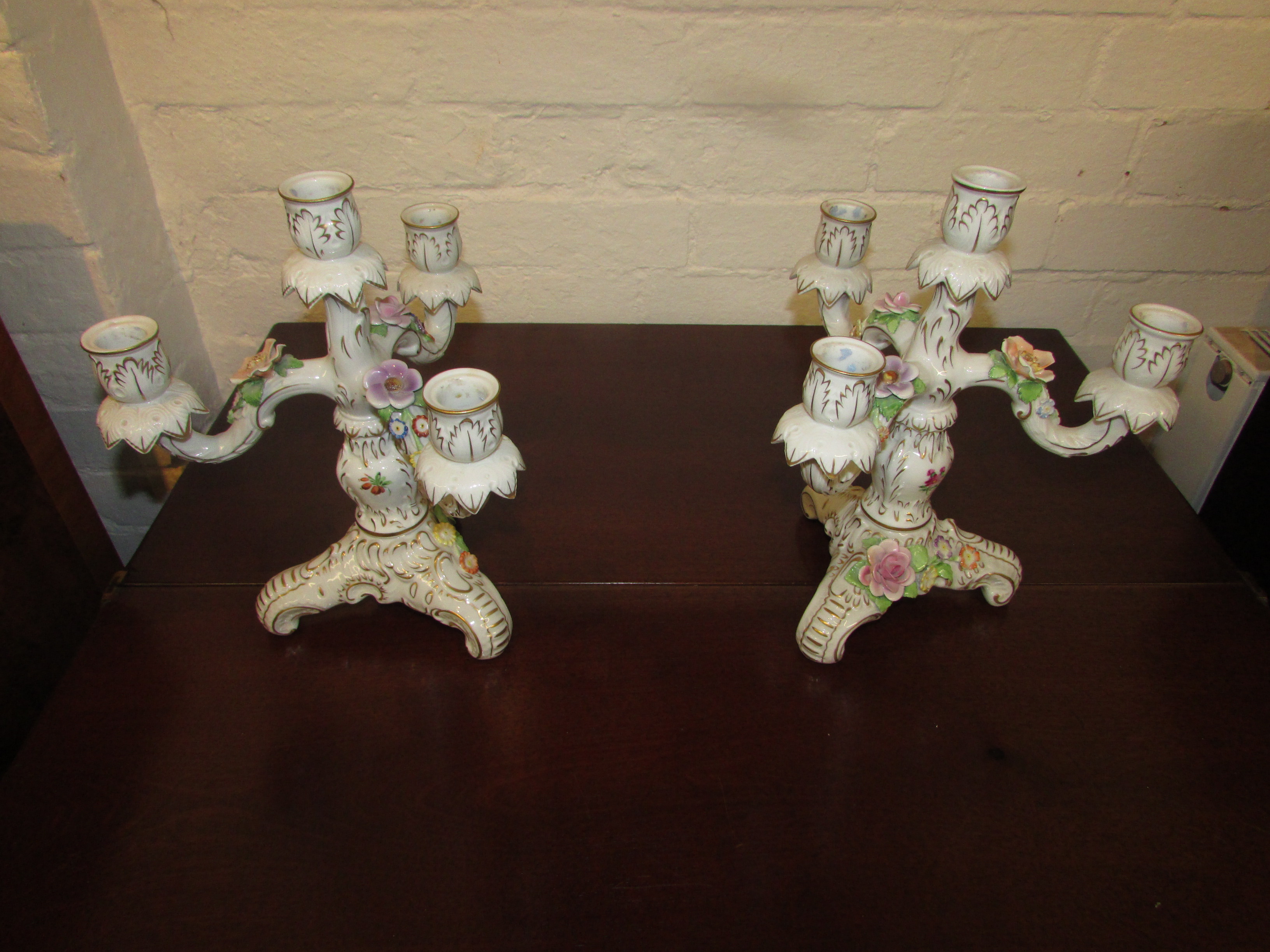 Pair of Porzellan Manufaktur Plaue floral encrusted candle holders, three-branch with central