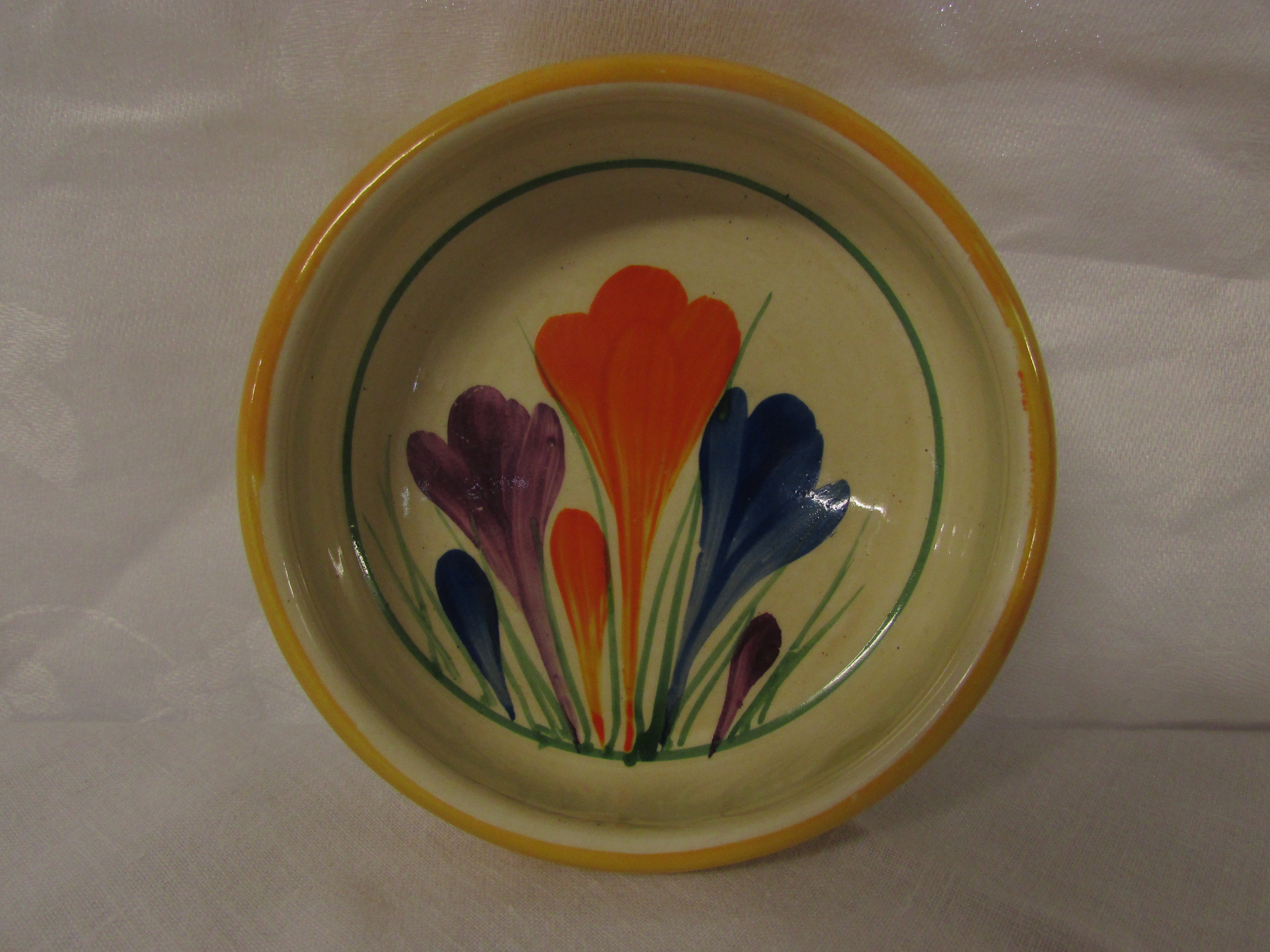 Bizarre by Clarice Cliff crocus circular dish, yellow rim, diameter 9.3cm, black transfer mark to - Image 2 of 3