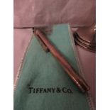 A Tiffany & Co white metal ball point pen stamped 925, length closed 8.8cm, with Tiffany branded