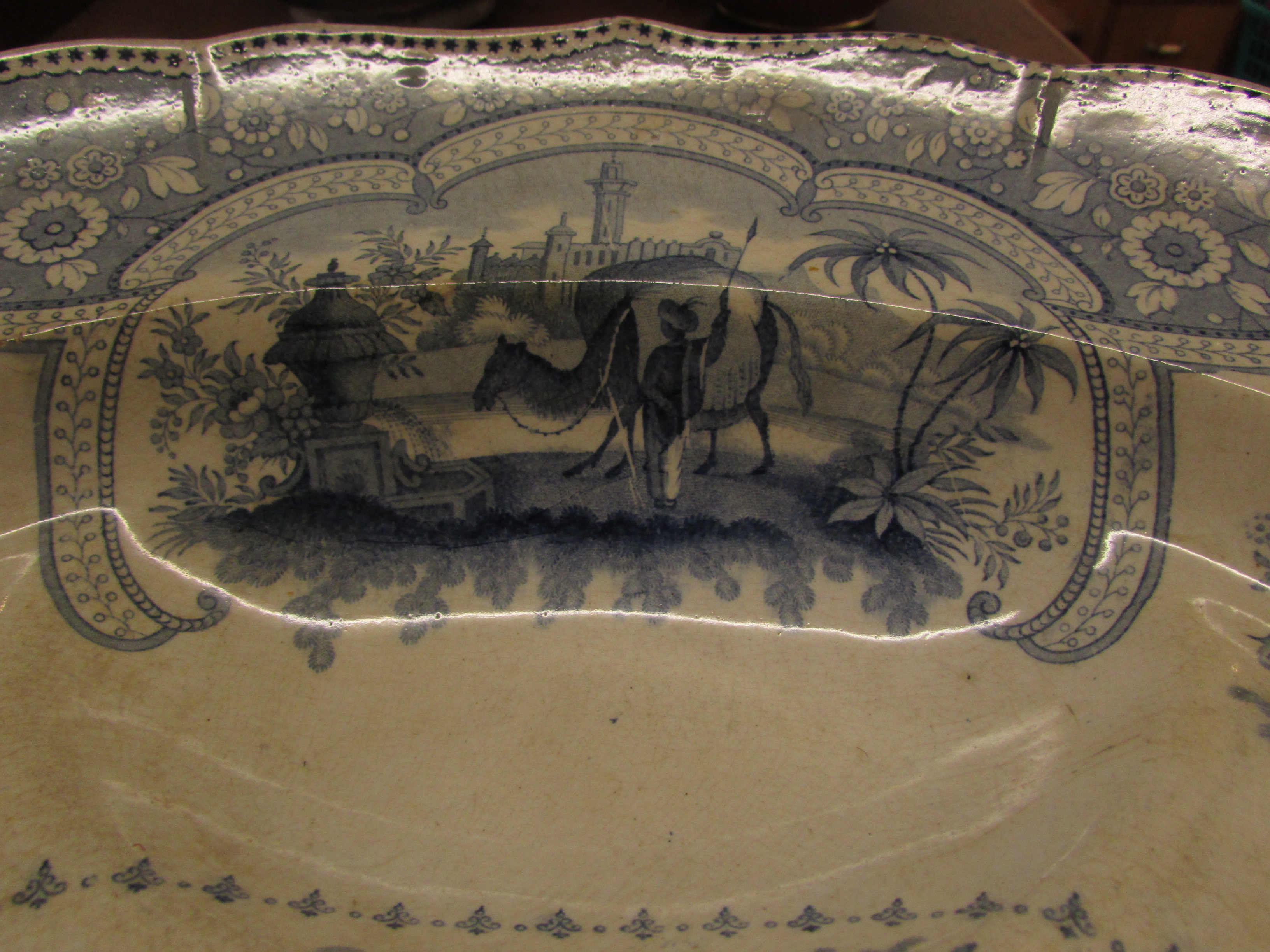 A large pottery meat or turkey plate, 19th century and transfer decorated in blue on white, the base - Image 3 of 5