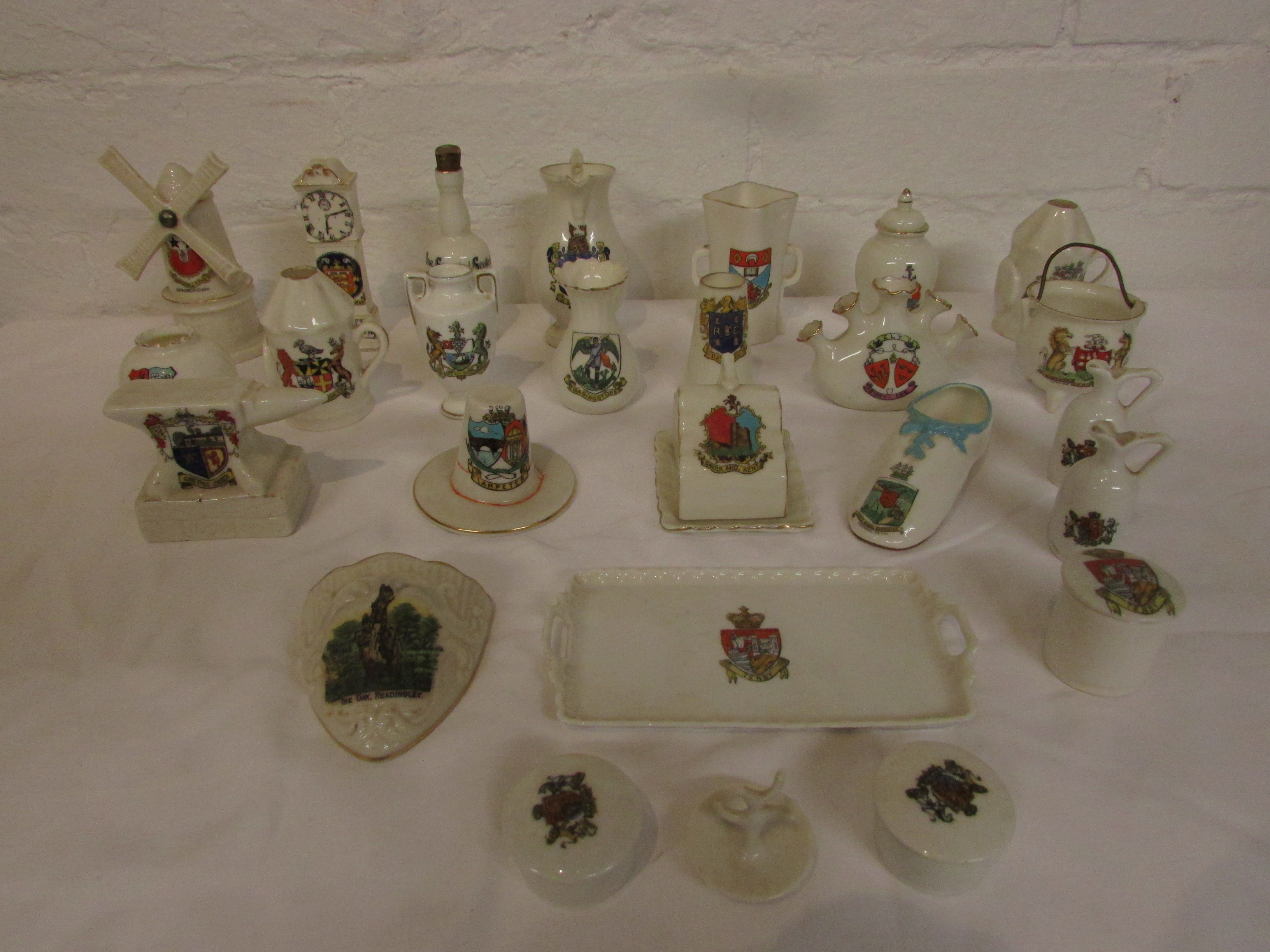 Twenty-five items of crested china depicting various objects, windmill, clock, anvil etc - Goss,