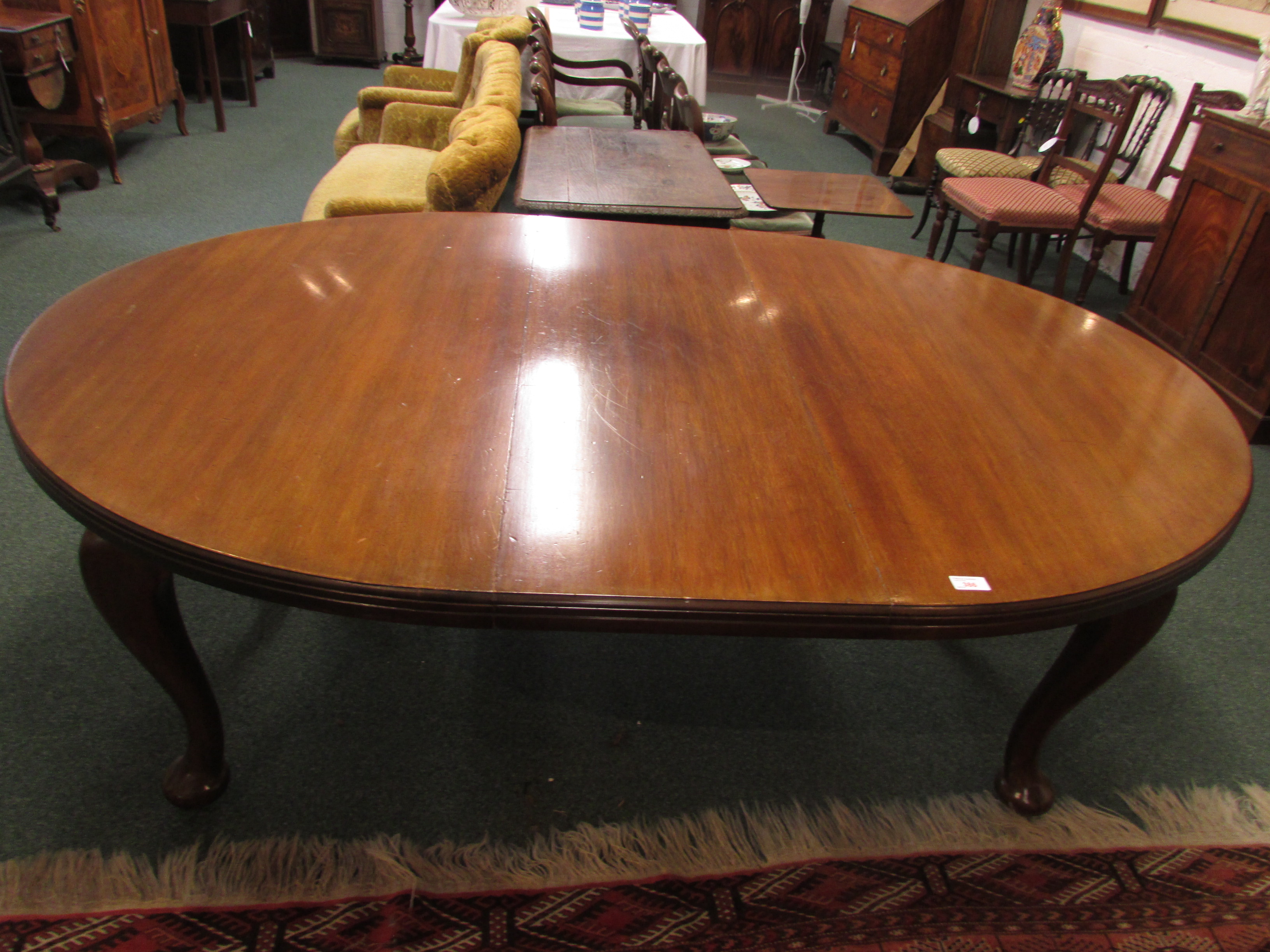 Victorian D-end wind-out extending mahogany dining table on cabriole legs with pad feet and brown