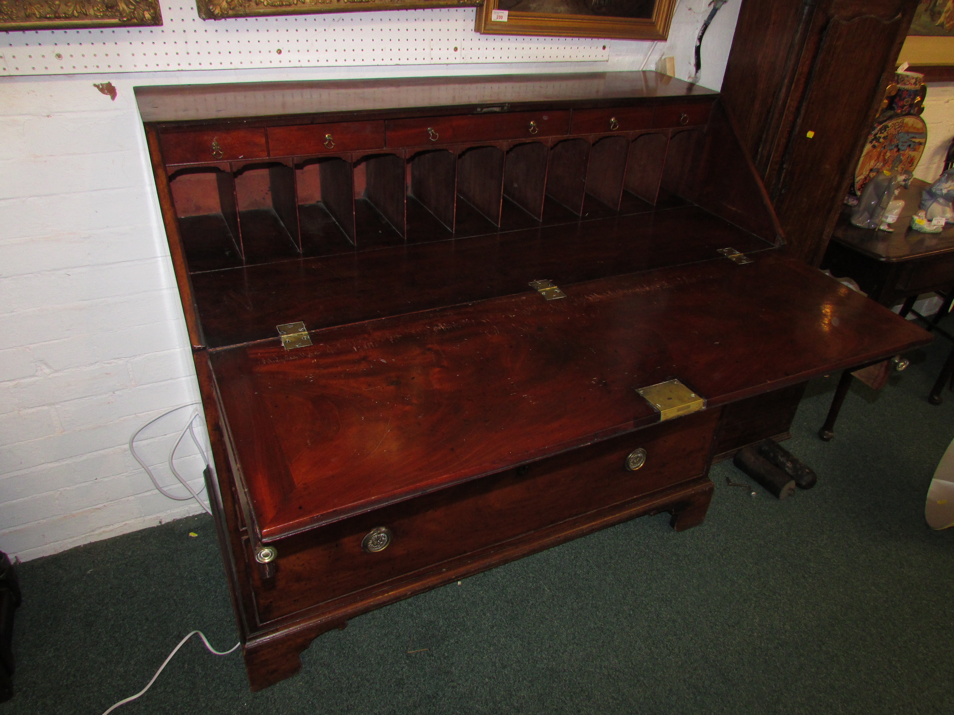 A 19th century large and wide mahogany bureau, the interior with a line of five small drawers over a - Image 4 of 8