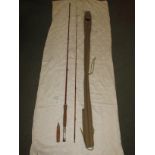 J S Sharpe 9.5' two-piece Scottie impregnated fishing rod with cork handle, 291cm, with canvas bag