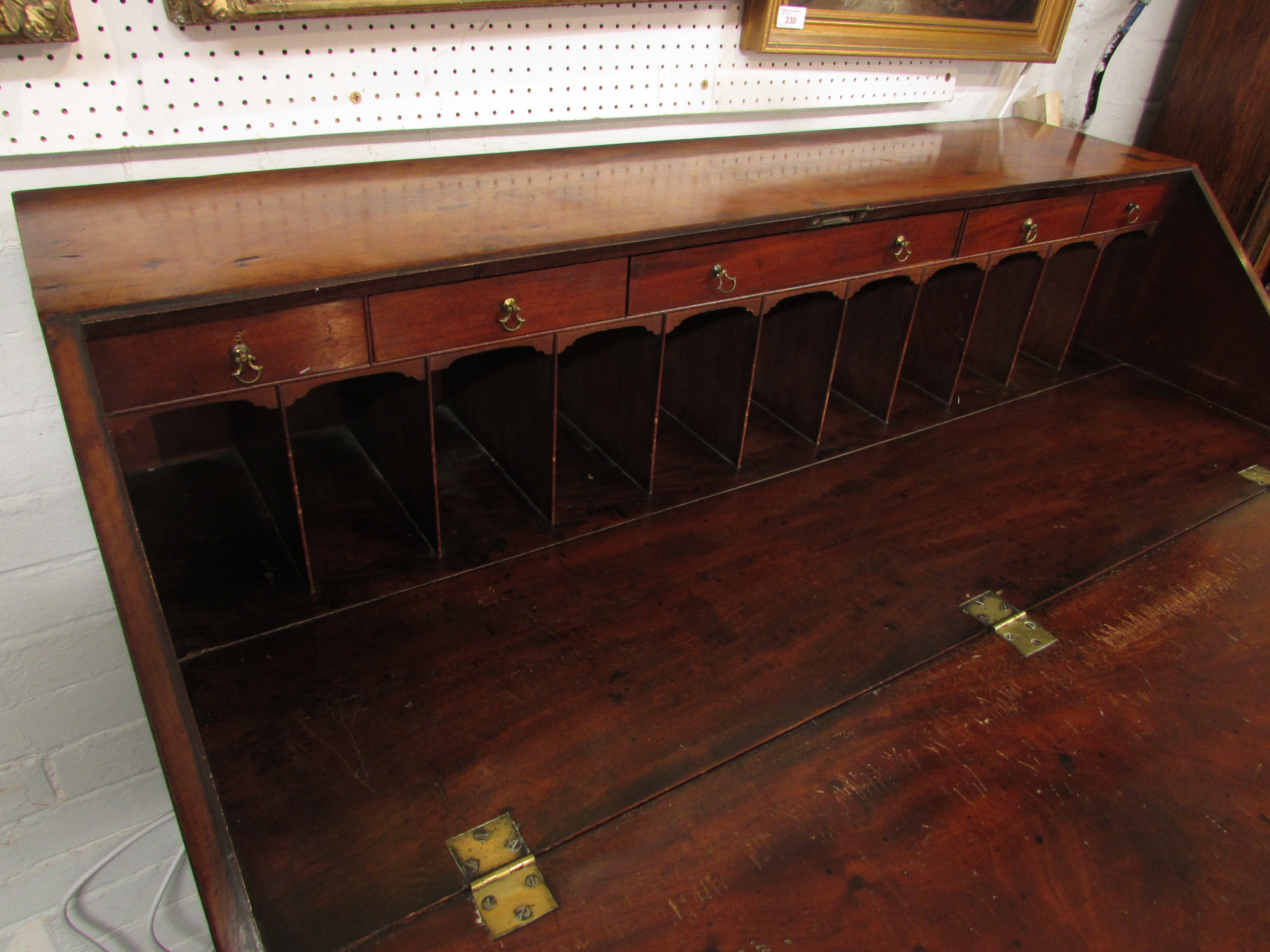 A 19th century large and wide mahogany bureau, the interior with a line of five small drawers over a - Image 5 of 8