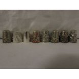EIGHT WHITE METAL THIMBLES - one plain stamped 925, three with applied coloured stones and stamped