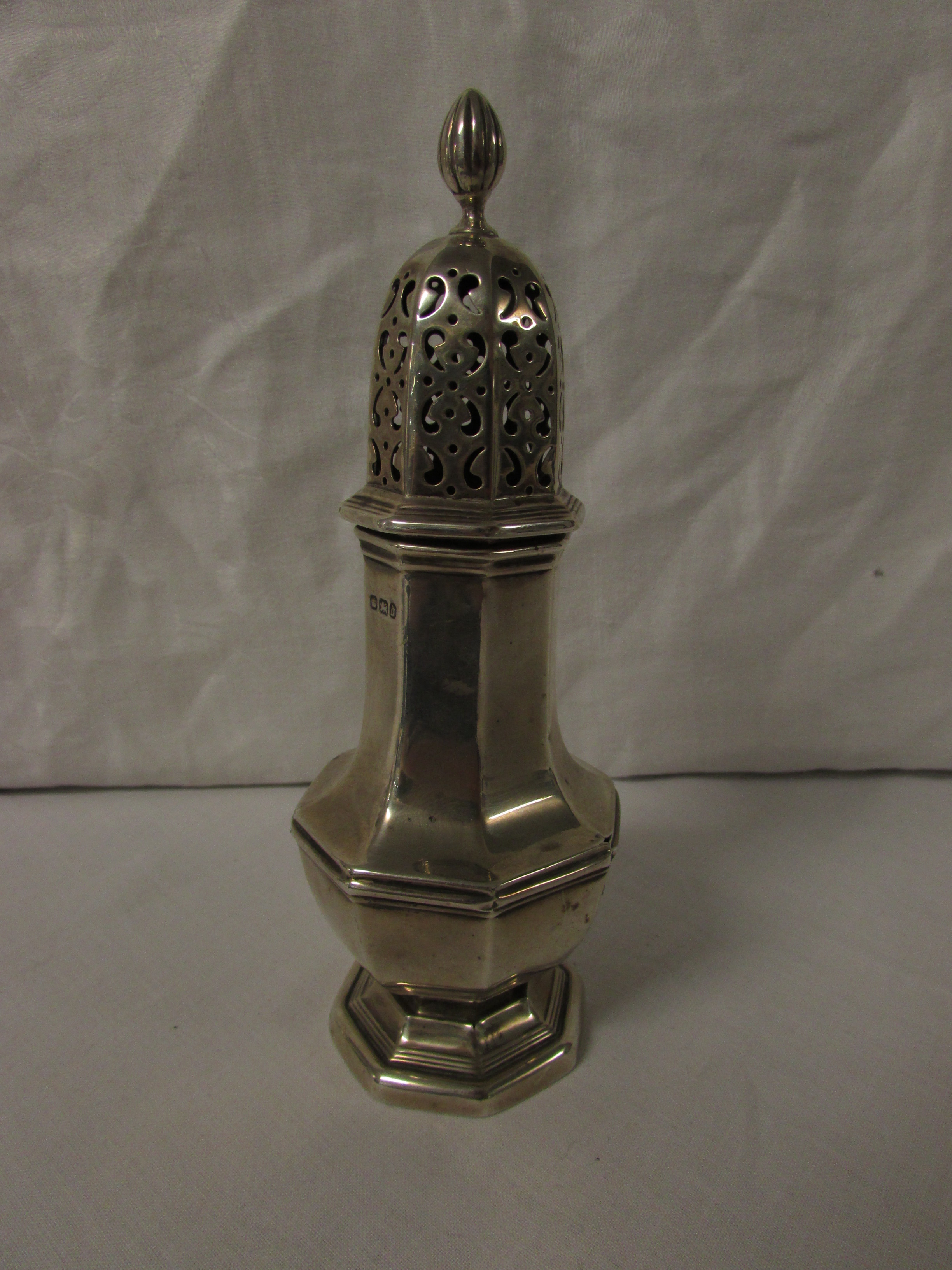 A late Victorian silver sugar caster of octagonal baluster form, marks for Sheffield, 1896,