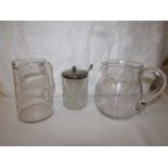 A glass cream jug engraved with stemmed berries, a glass tankard engraved 'with every good wish