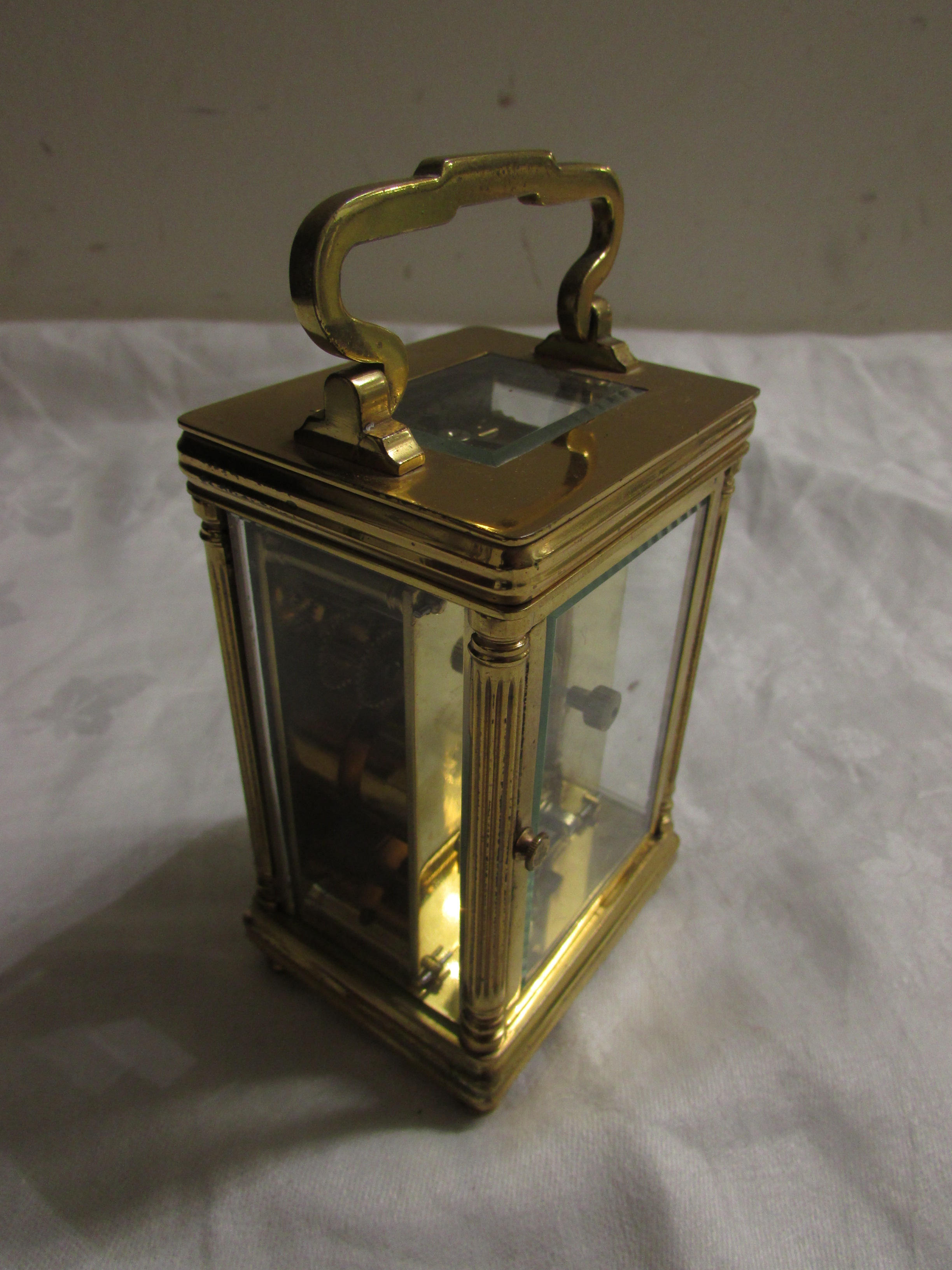 Brass carriage clock signed Mallory of Bath, French movement, (12cm x 7.5cm x 6cm) in original red - Image 4 of 6