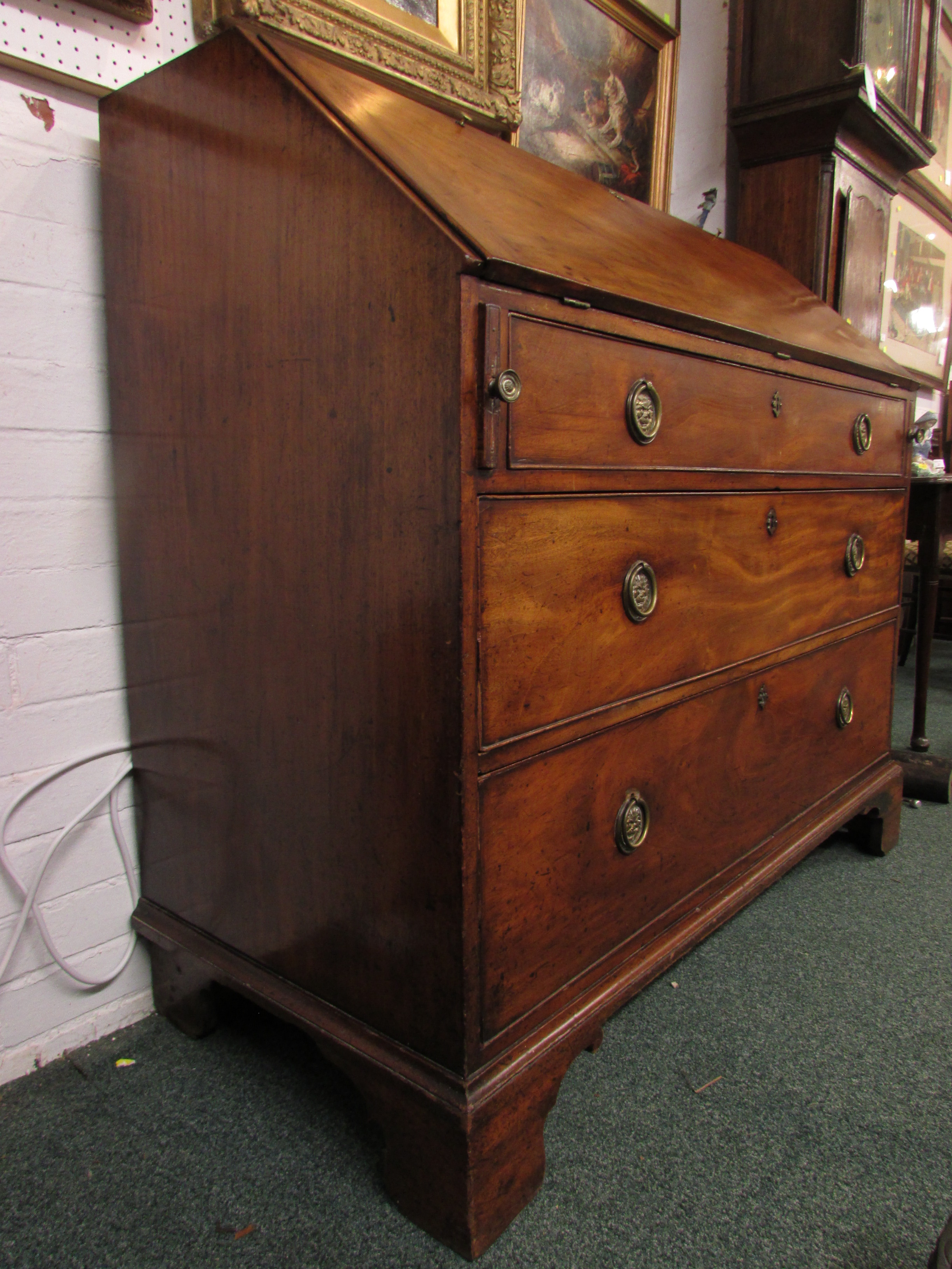 A 19th century large and wide mahogany bureau, the interior with a line of five small drawers over a - Image 3 of 8