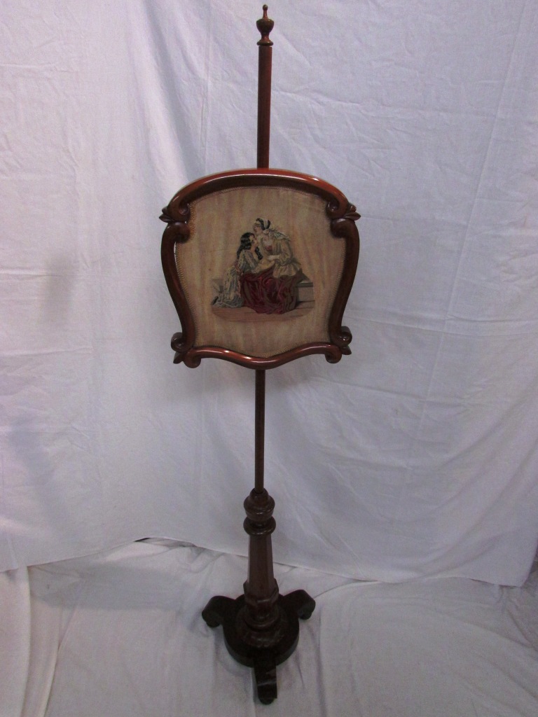 Victorian mahogany pole fire screen, the shield shaped screen (38cm x 36cm) depicting seated woman