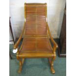 Far Eastern rocking chair with mid wood frame and lattice seat and back, height of back rail 95cm