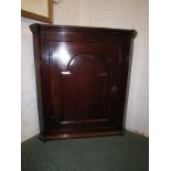 George III oak corner cabinet, the single door with arched moulding and on iron H hinges, engraved