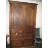 An early 19th century provincial French housekeeper's cupboard. The base has two short and two