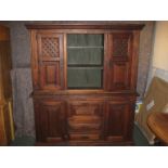 A 20th century dark stained dresser with Far Eastern influence to the styling, the upper section