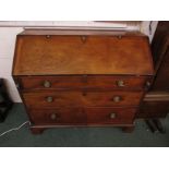 A 19th century large and wide mahogany bureau, the interior with a line of five small drawers over a