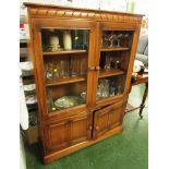ERCOL MID ELM GLAZED DISPLAY CABINET WITH TWO INTERNAL SHELVES AND TWO CUPBOARD DOORS TO BASE