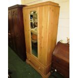 STRIPPED PINE SINGLE DOOR WARDROBE WITH BEVELLED MIRROR AND SINGLE DRAWER TO BASE