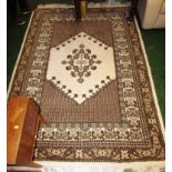 CREAM AND BROWN GROUND PATTERNED FLOOR RUG