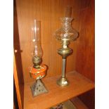 BRASS COLUMN OIL LAMP WITH GLASS SHADE AND COLOURED GLASS AND CAST METAL OIL LAMP WITH GLASS