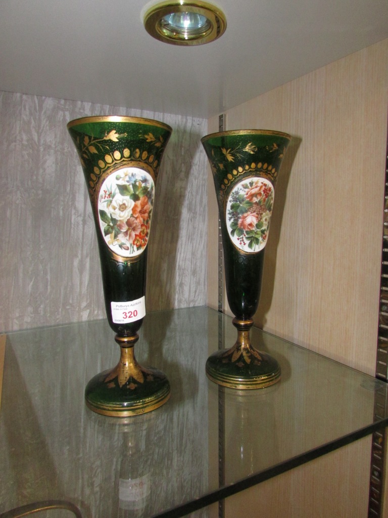 PAIR OF GREEN AND GILT GLASS CHALICES WITH FLORAL PORCELAIN BADGES