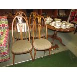 ERCOL MID ELM SINGLE PEDESTAL CIRCULAR DINING TABLE AND FOUR CHAIRS WITH CARVED SWAN BACKS