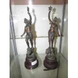 PAIR OF CAST METAL FRENCH FIGURINES ON BAKELITE PLINTHS