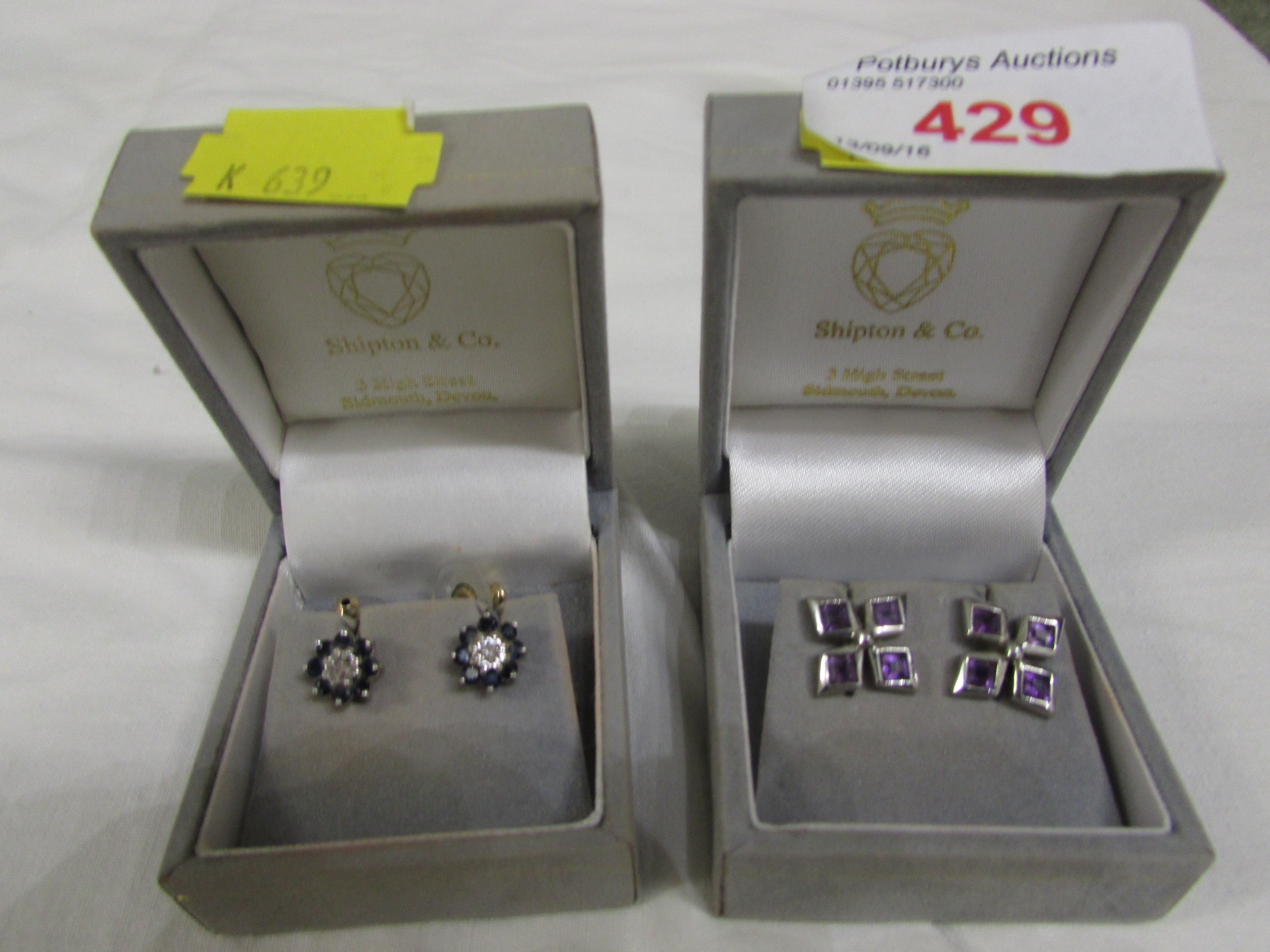 PAIR OF 9-CARAT GOLD EARRINGS SET WITH SMALL SAPPHIRES, AND PAIR OF WHITE METAL EARRINGS SET WITH