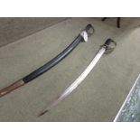 PAIR OF SWORDS WITH CURVED ETCHED BLADES MARKED 'MADE IN INDIA' IN BLACK LEATHER SHEATHES