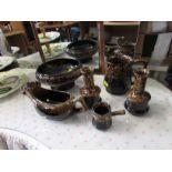 TWO TIER CERAMIC FRUIT STAND AND SET OF POTTERY DINING ITEMS IN BROWN MOTTLED GLAZE