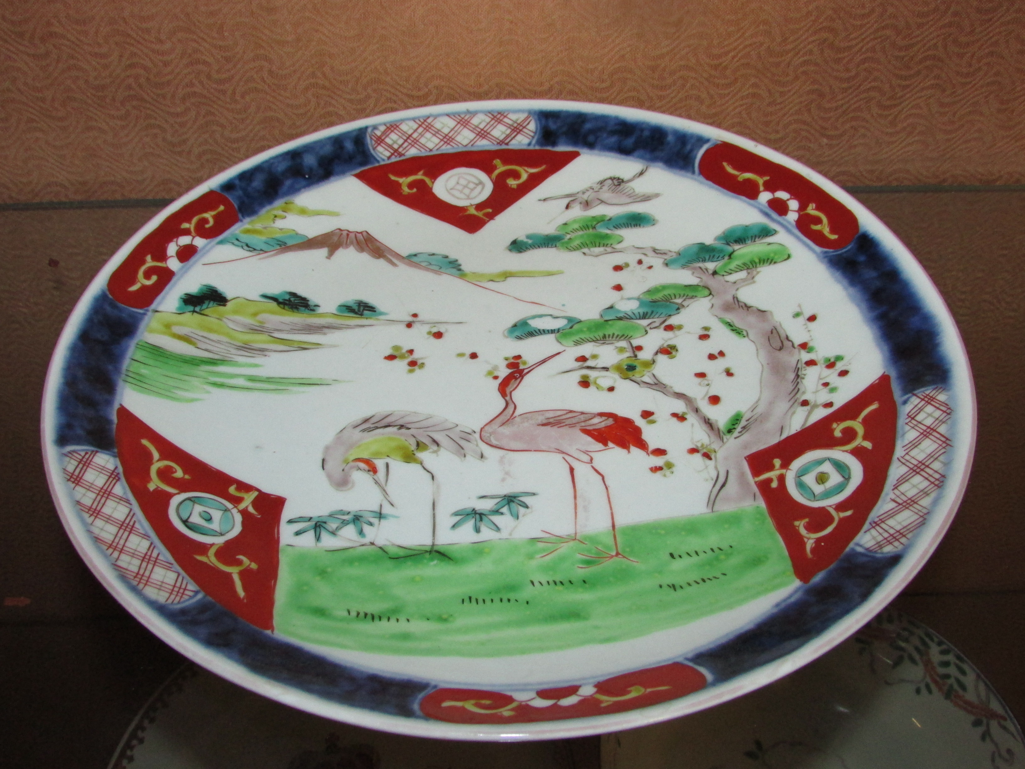 JAPANESE STYLE PLATE ENAMELLED WITH CRANES AND MOUNTAIN, A PLATE WITH ARMORIAL ENAMELLING, AND A - Image 2 of 4