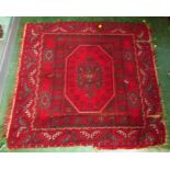 MIDDLE EASTERN STYLE RED GROUND RUG WITH SINGLE MEDALLION AND PATTERNED MARGINS