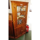 PINE CORNER DISPLAY CABINET WITH GLAZED DOOR TO TOP AND ELECTRICAL ILLUMINATION