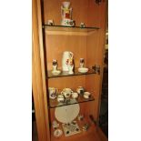 FOUR SHELVES OF DECORATIVE CRESTED CHINAWARE