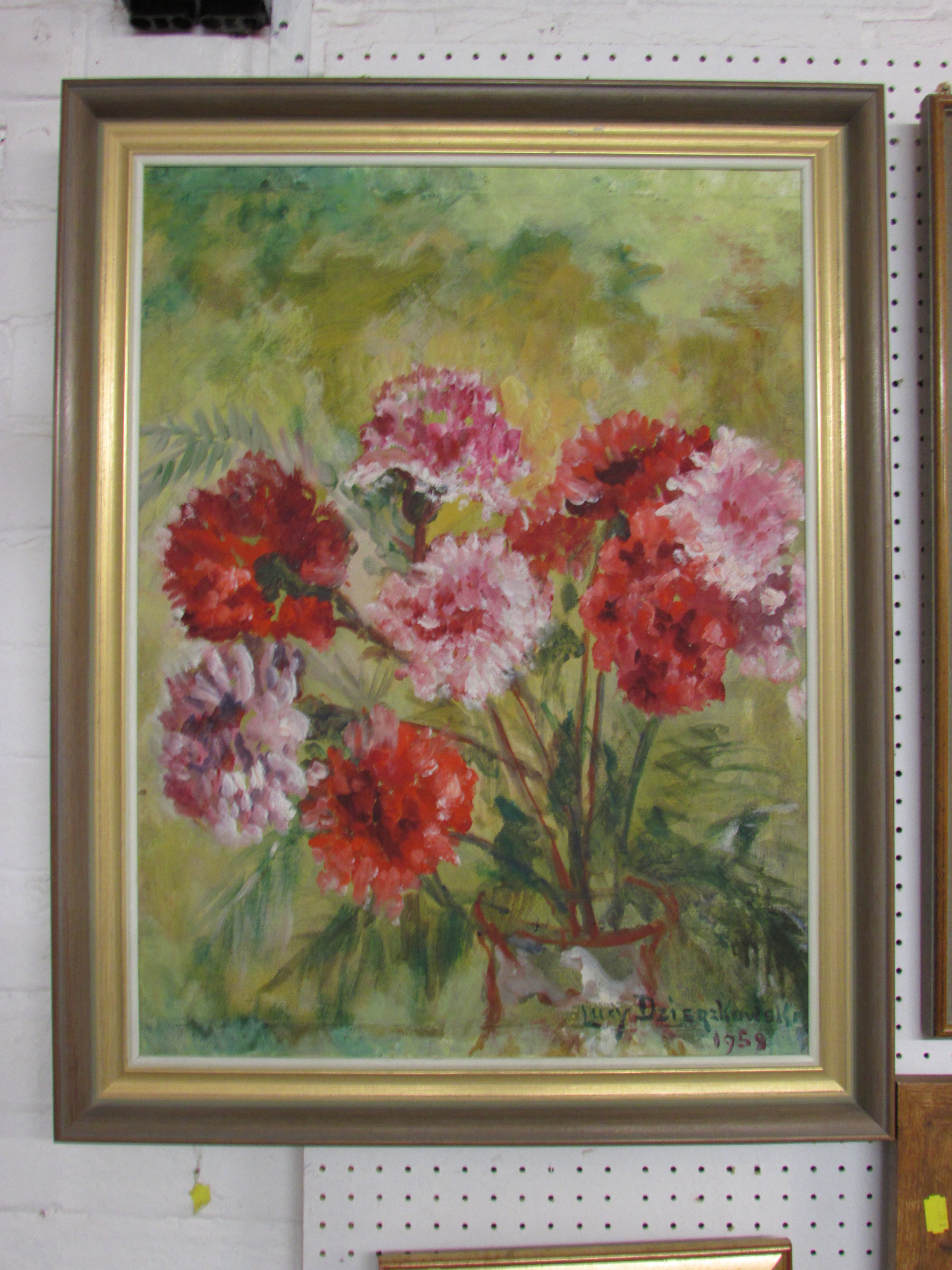 Still life with red flowers, oil on board, signed and dated Lucy Dzierzkowski 1959, (59cm x 44cm),