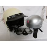 Halcyon motorcycle goggles, Cromwell motorcycle helmet and one other motorcycle helmet