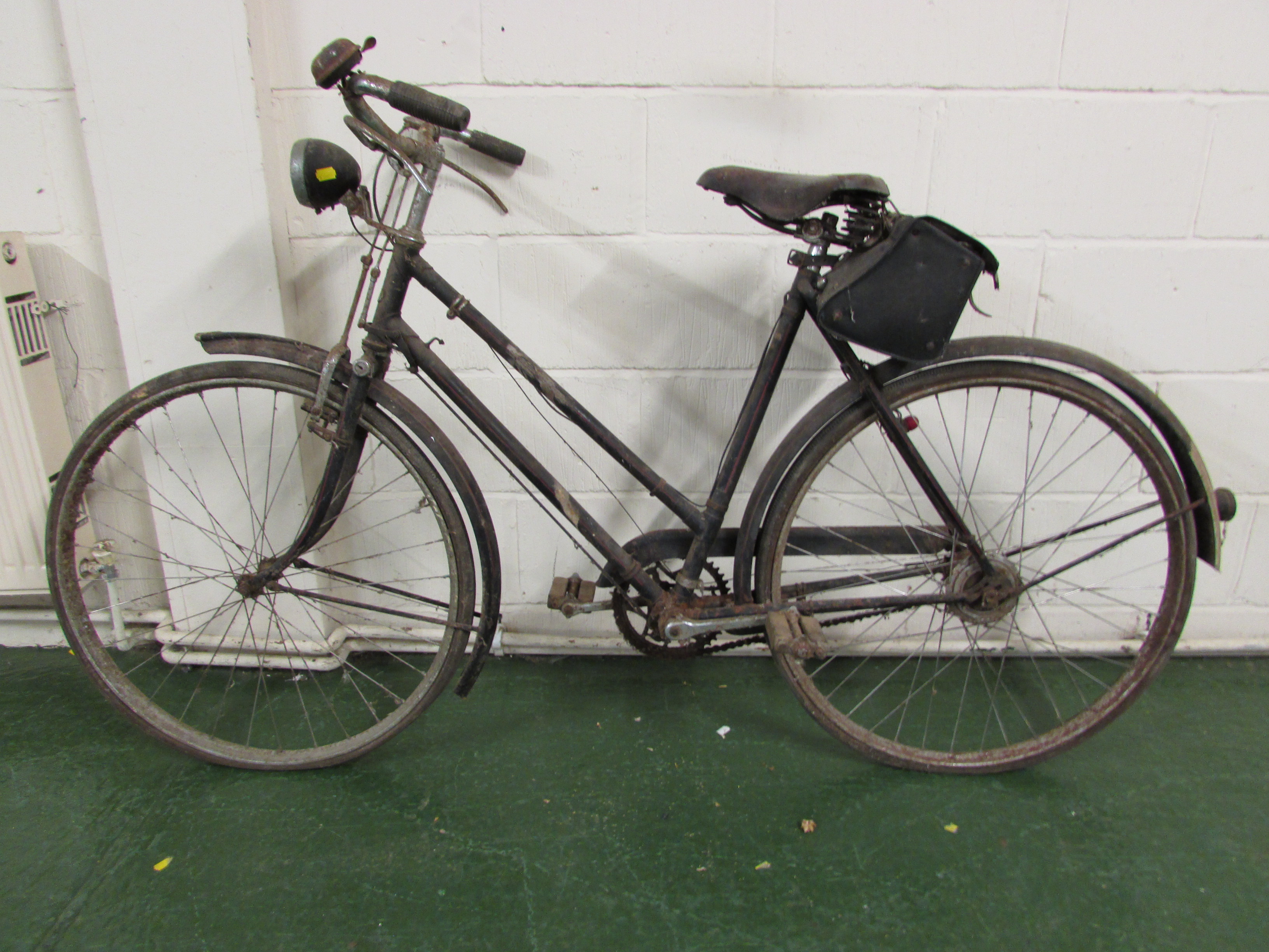 Vintage Raleigh three-speed bicycle with Brooks saddle and rear leather bag