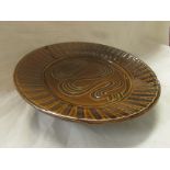 Wenford Bridge Pottery plate, stoneware with brown and ochre slip glaze, combed decoration, by