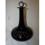 Amethyst cut glass decanter, the body etched with a continuous thistle spray, indented to base,