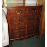 MAHOGANY AND WALNUT VENEERED BOW FRONTED REPRODUCTION CHEST OF DRAWERS WITH METAL HANDLES