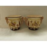 Pair of Sylvac pottery Assyrian vases, decorated in browns and yellows with winged beasts and