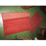 PAIR OF RED GROUND PATTERNED FLOOR RUGS