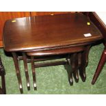 NEST OF THREE ERCOL DARK ELM OCCASIONAL TABLES, TOGETHER WITH ERCOL DARK ELM TRESTLE OCCASIONAL